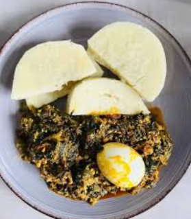 Kontomire stew with boiled yam
